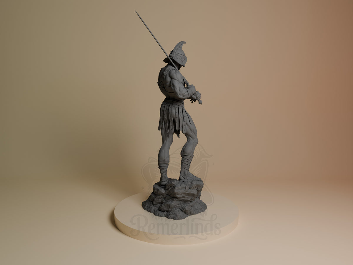 Gladiator resin figure shown from back, standing on rocky base with spear raised, wearing helmet, armor and skirt, unpainted gray finish.