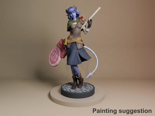 Jester resin figure from The Mighty Nein in dynamic pose holding staff and shield, painted in purple, green, and blue on detailed base.
