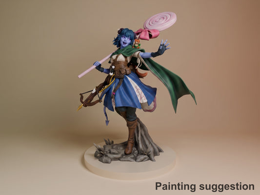 Painted Jester from The Mighty Nein resin figure poses with a lollipop and bow on a rocky base.