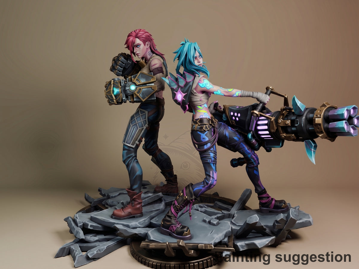 Jinx and Vi from Arcane posed back-to-back on rocky base, fully painted resin diorama with weapons, shot against neutral backdrop.