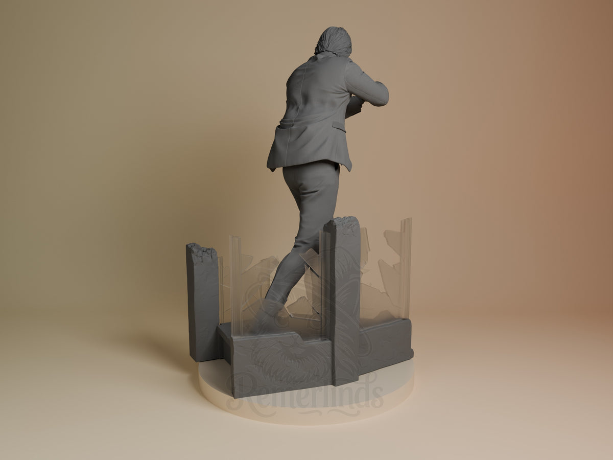 John Wick resin figure shown from behind in running pose on rocky base, wearing business suit with hair tied back, unpainted gray finish.