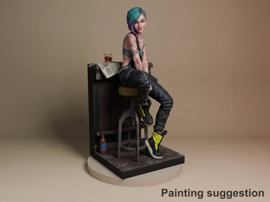 Judy resin figure from Cyberpunk 2077 seated at bar counter, turquoise hair, tattooed arms, black outfit with yellow accents, painted detail on dark base.