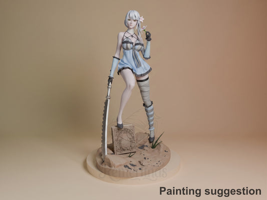Kainé resin figure from NieR: Automata in painted white and blue outfit, posed with sword on sandy base, shown from front angle.