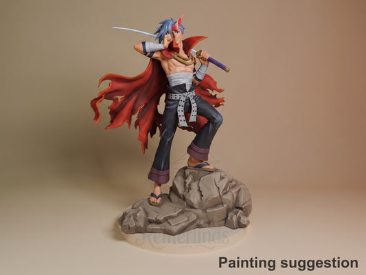 Kamina resin figure in dynamic pose on rocky base, holding sword and axe, red cape flowing, blue and red hair, painted with detailed costume.
