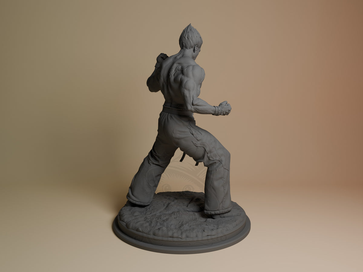 Kazuya from Tekken resin figure shown from behind in dynamic fighting stance, unpainted gray detail, round textured base.