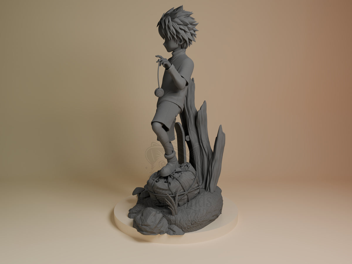 Side-angle view of Killua from Hunter x Hunter, an unpainted resin figure posing on a sculpted rocky base.