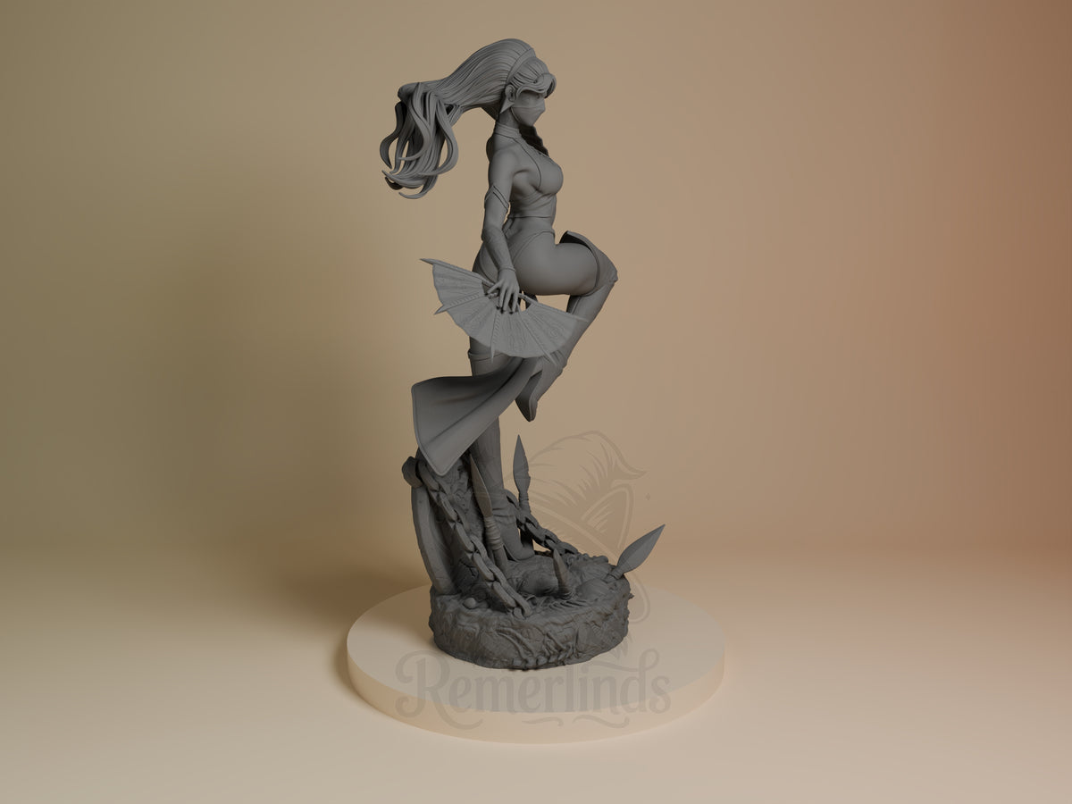 Right-side view of unpainted Kitana from Mortal Kombat, a resin figure holding fans on a sculpted base.