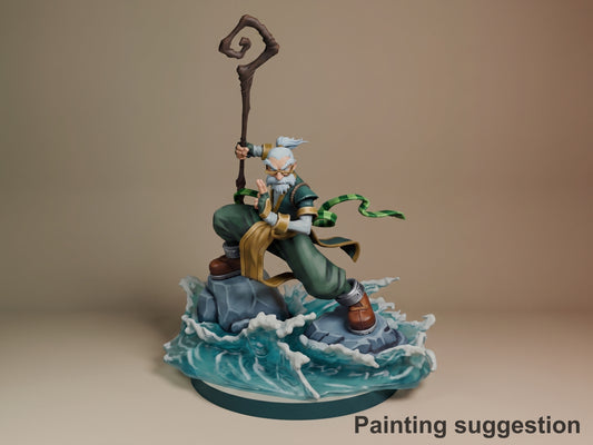 Knolan from Battle Chasers resin figure painted in green robes, wielding a spiral staff, posed on a dynamic water-effect base with green snake familiar.