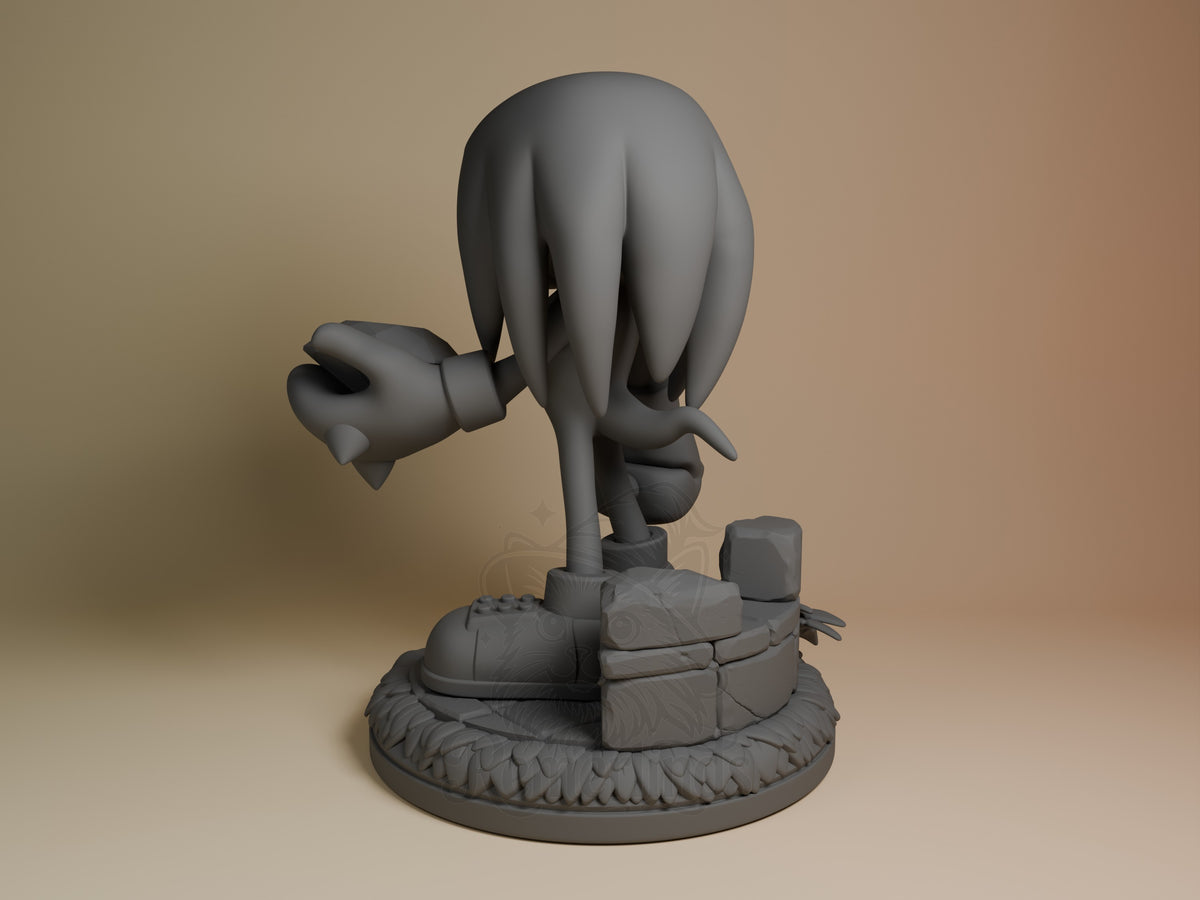 Knuckles resin figure shown from left side in unpainted gray, mid-punch pose on detailed base with crates and textured ground.