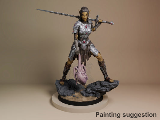 Lae'Zel from Baldur's Gate 3D resin figure painted in silver armor and purple accents, posed with dual weapons on a rocky base.