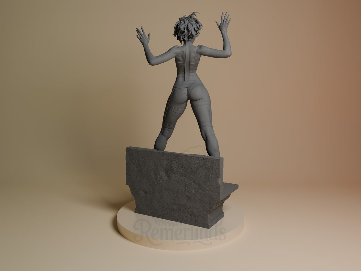 Leeloo from The Fifth Element is rear-facing, an unpainted resin figure on a sculpted base.