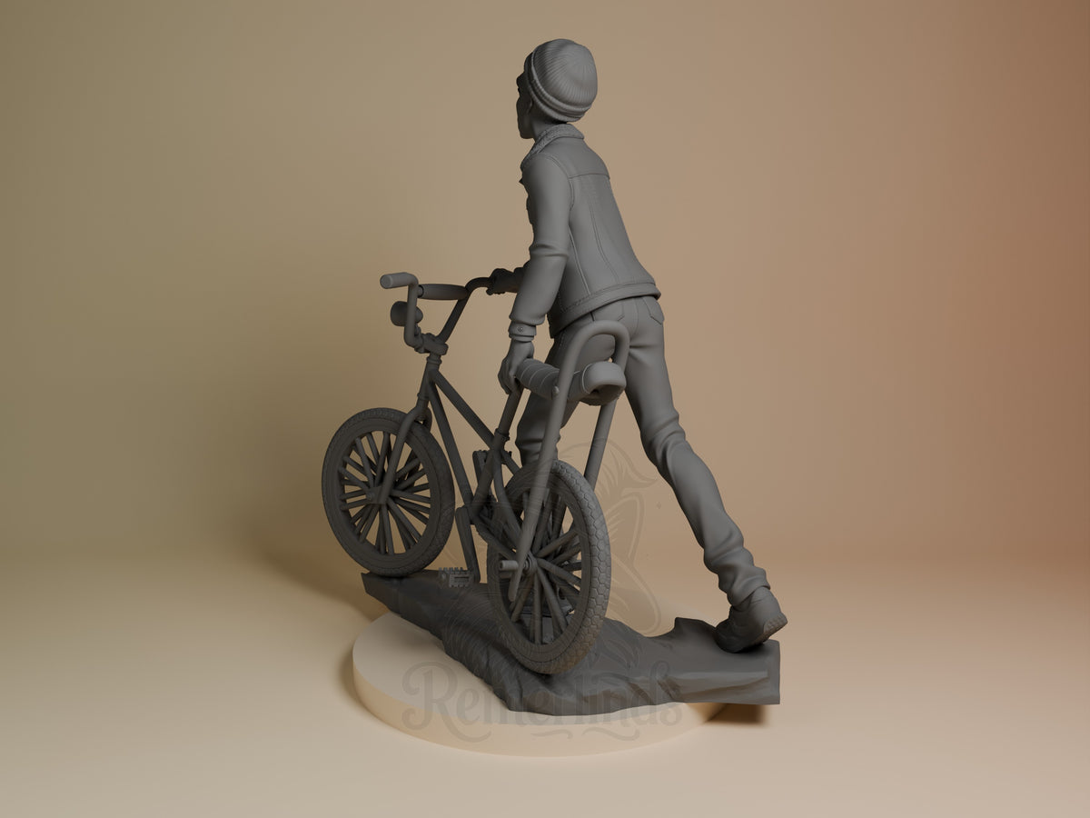 Lucas from Stranger Things is an unpainted resin figure viewed from behind with a bicycle on a sculpted base.