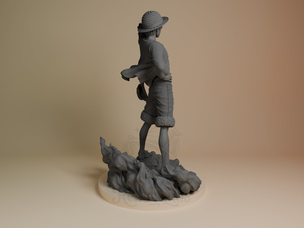 Luffy resin figure from One Piece shown from behind, standing on rocky base wearing straw hat and coat, unpainted gray finish.