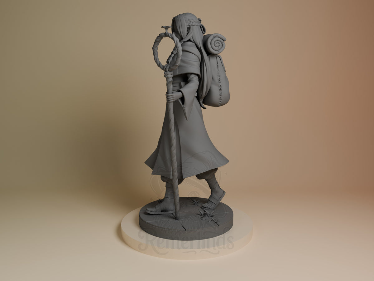 Marcille resin figure from Delicious in Dungeon in gray unpainted plastic, posed holding staff and pouch, displayed on textured base at three-quarter angle.