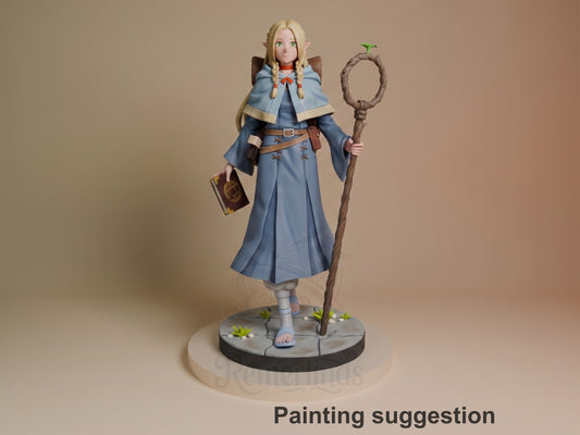 Marcille resin figure from Delicious in Dungeon, painted in blue robes with cape, holding staff, standing on scenic base with small plants.