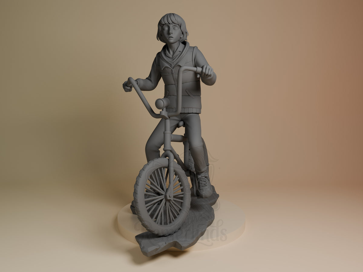 Front-angle Mike from Stranger Things resin figure, unpainted on a bicycle and sculpted base.