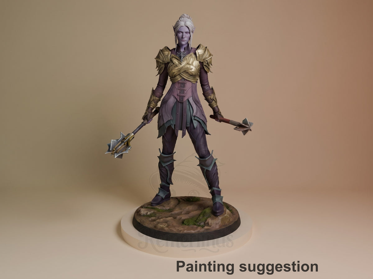Painted resin figure of Minthara from Baldur's Gate, standing in wide stance holding dual weapons, gold top and purple lower outfit, on textured base.