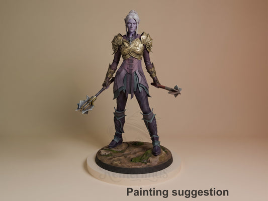 Painted resin figure of Minthara from Baldur's Gate, standing in wide stance holding dual weapons, gold top and purple lower outfit, on textured base.