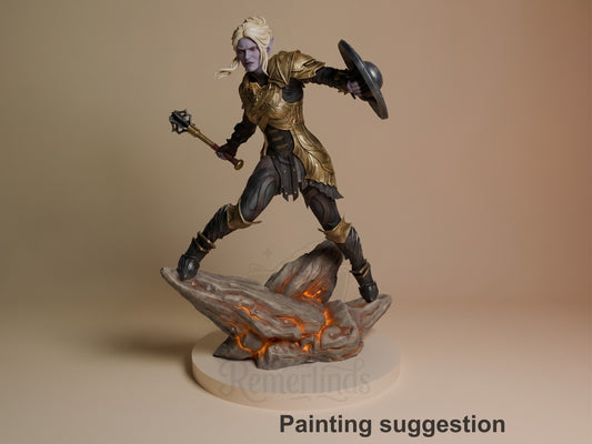 Minthara resin figure in dynamic combat pose wielding mace and shield, blonde hair, gold and black armor, standing on lava base, painted example.