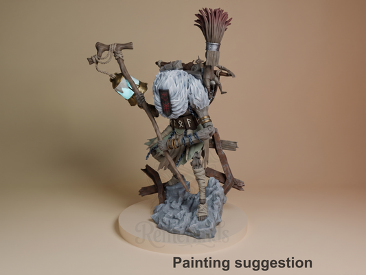 Monoco from Expedition 33 is a painted resin figure in three-quarter pose, holding a staff on a rocky base.