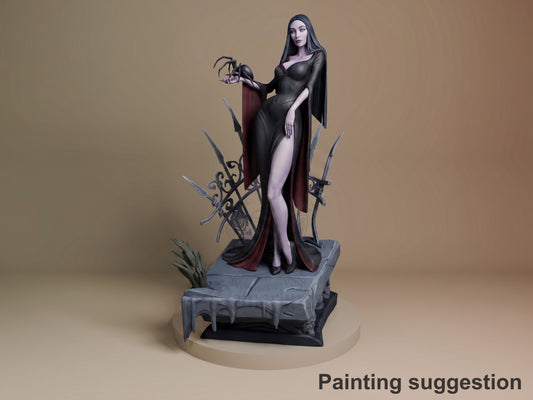 Morticia resin figure in black dress with burgundy cape, holding rose, posed on stone base with decorative swords, fully painted.