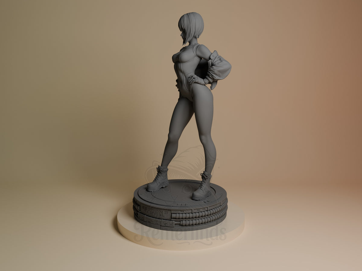 Motoko Kusanagi from Ghost in the Shell stands in profile on a sculpted base as an unpainted resin figure.