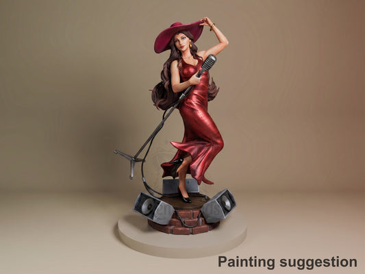 Metro Mayor Songstress resin figure in crimson dress and wide-brimmed hat, holding microphone on speaker-equipped base, shown from front three-quarter angle.