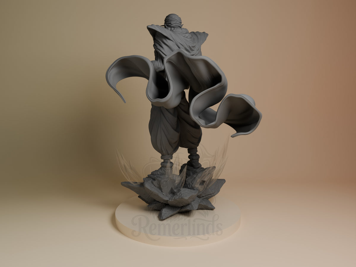 Green Warrior Monk resin figure from Dragon Sphere Y shown from left angle in dynamic pose with flowing robes and cape, unpainted gray finish, mounted on textured base.