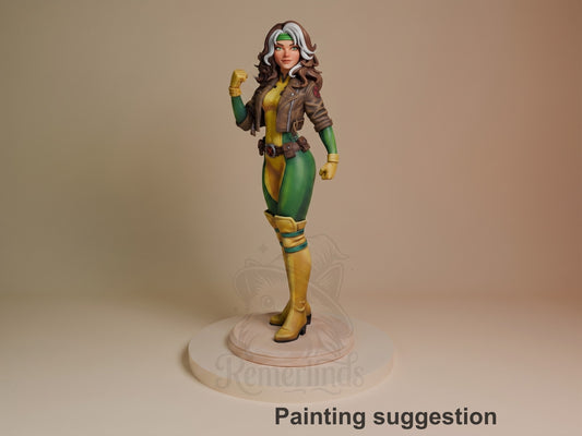 Crimson Drifter resin figure from Mutant Heroes in painted yellow and green costume with brown jacket, posed standing on circular base against neutral background.