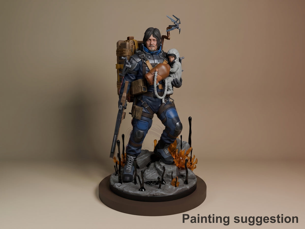 Sam from Death Stranding resin figure in full tactical gear, holding a baby pod and climbing tool, posed on a fire-lit base with detailed painting.