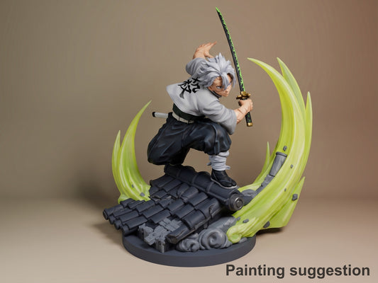 A painted resin figure of Sanemi from Demon Slayer crouches with a sword on a sculpted base.