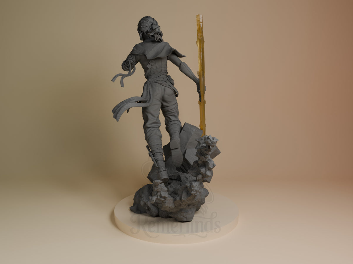Sciel from Expedition 33 resin figure shown from the rear, holding a staff on an unpainted rocky sculpted base.