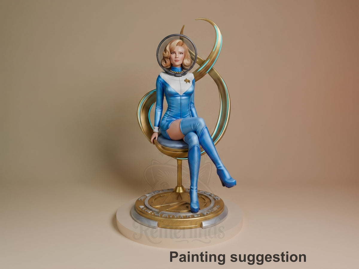 Painted Starfleet Officer from Startrek resin figure sits front-facing with one leg crossed on a sculpted base.