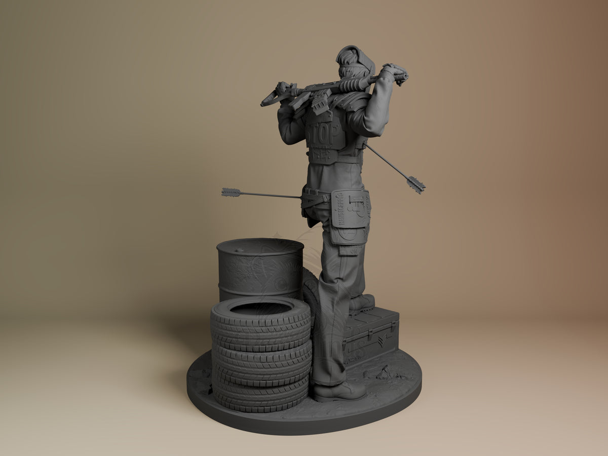 Survivor resin figure from Rust shown from back angle, standing on base with tires and cargo, unpainted gray detail visible.