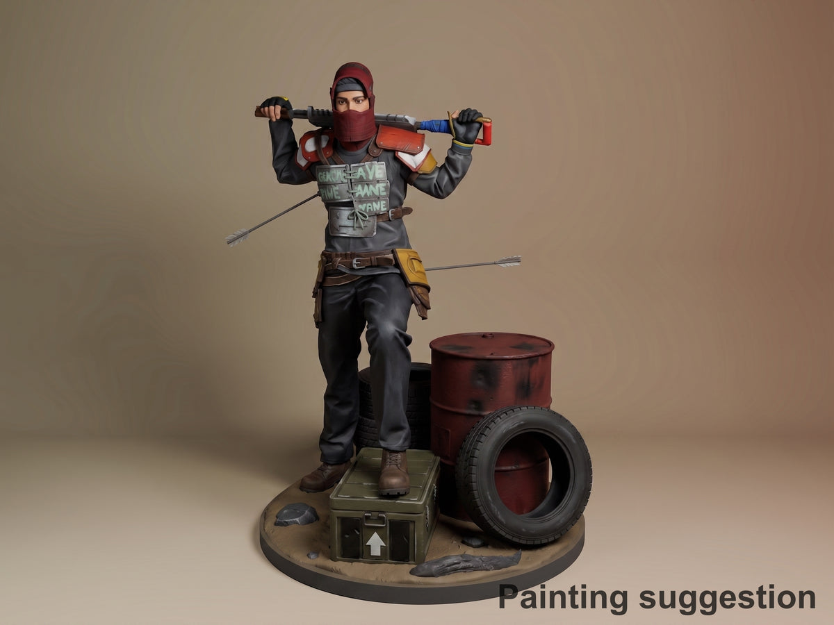 Painted resin figure of Survivor from Rust, posed dynamically with tools, standing on base with barrel and tire, shown from front angle.