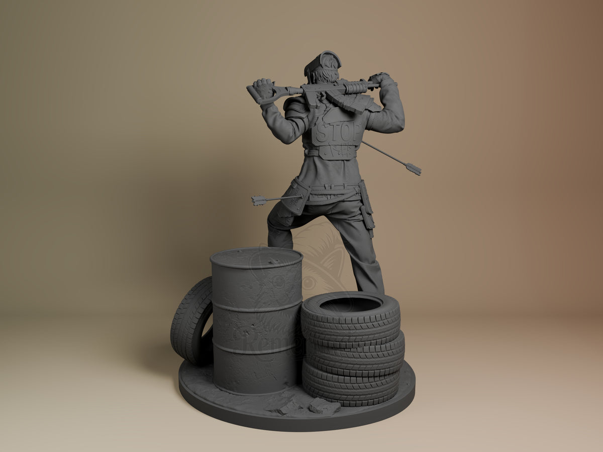 Unpainted gray resin figure of Survivor from Rust standing on base with barrels and tires, holding pipe weapon, viewed from left angle.