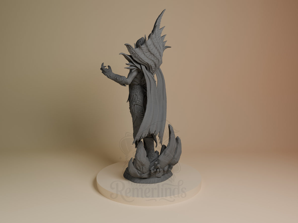 The Emperor resin figure from Baldur's Gate shown from left side, unpainted gray, with wings spread and cape flowing, standing on cream base.