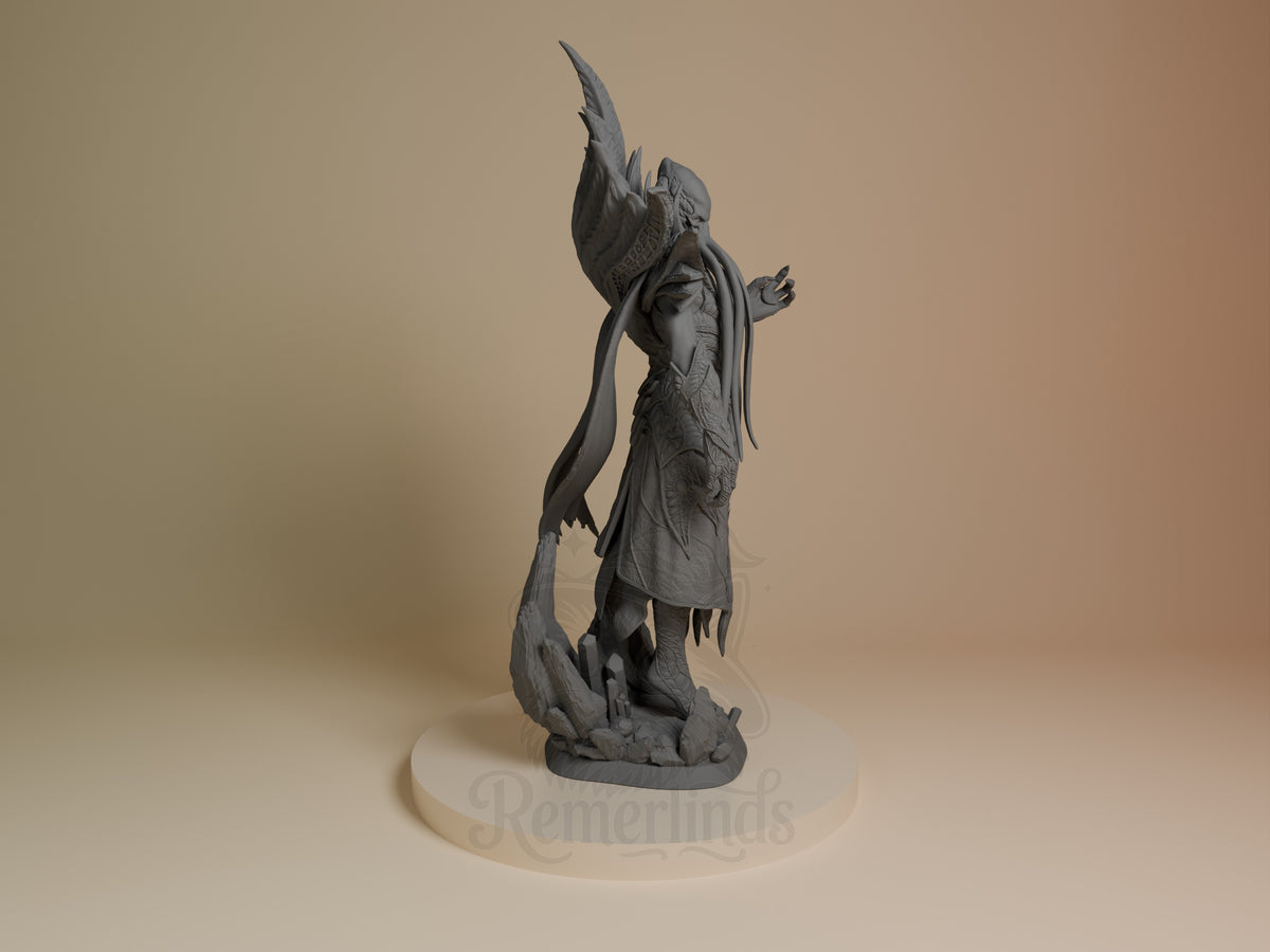 The Emperor resin figure from Baldur's Gate shown from the right side, unpainted gray, standing upright with wings raised and long tail curved, on cream base.
