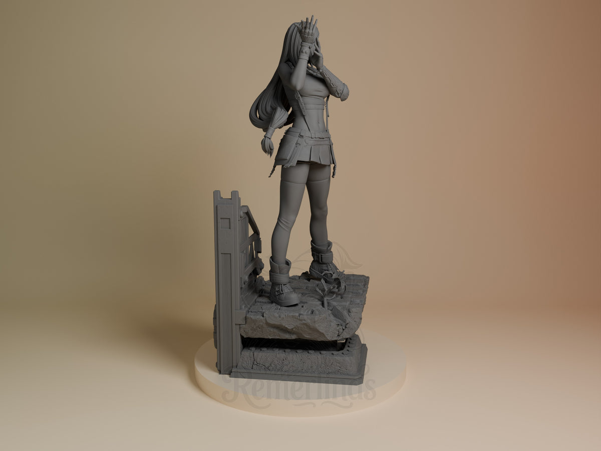 Tifa Lockhart resin figure shown from right side, standing on rocky base with architectural element, unpainted gray finish, hand raised to head.