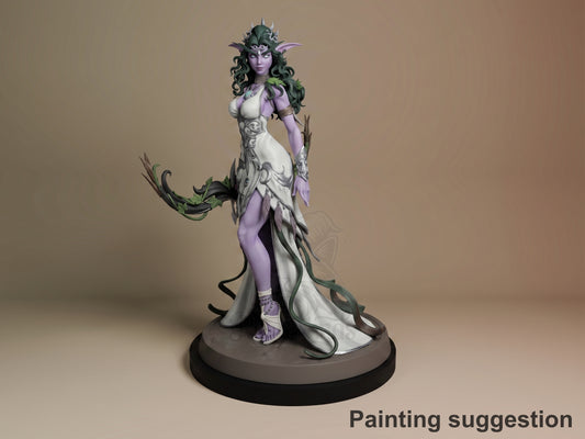 Tyrande resin figure from World of Warcraft, painted in purple and white, standing on round base with flowing cape and ornate headdress, front three-quarter view.