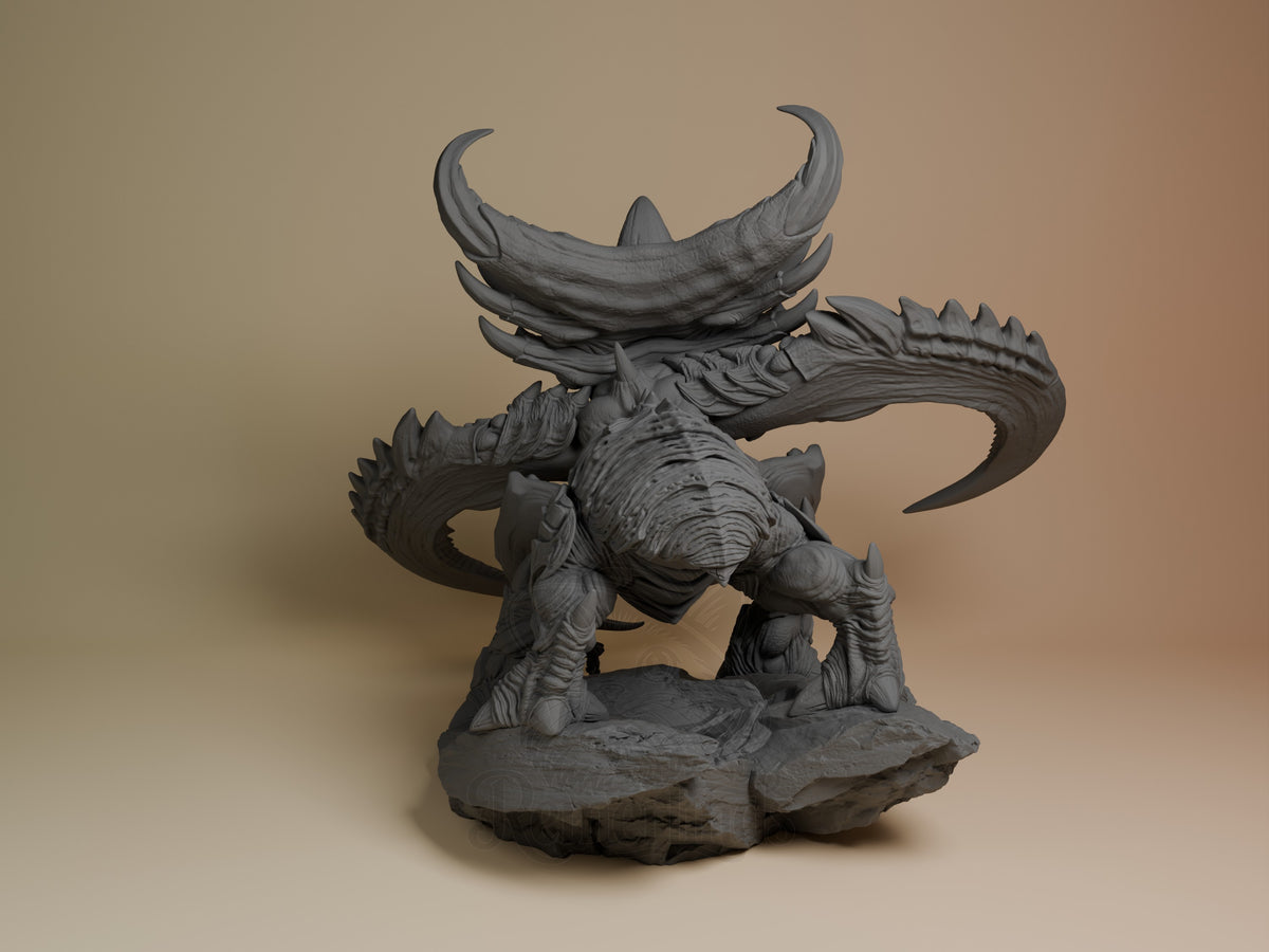 Ultralisk resin figure from StarCraft II shown from rear angle, displaying curved horns, spined back, and muscular legs on rocky base, unpainted gray resin.