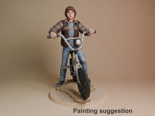 Will from Stranger Things 3D resin figure on wooden base, posed on BMX bike wearing brown jacket and striped shirt, fully painted.