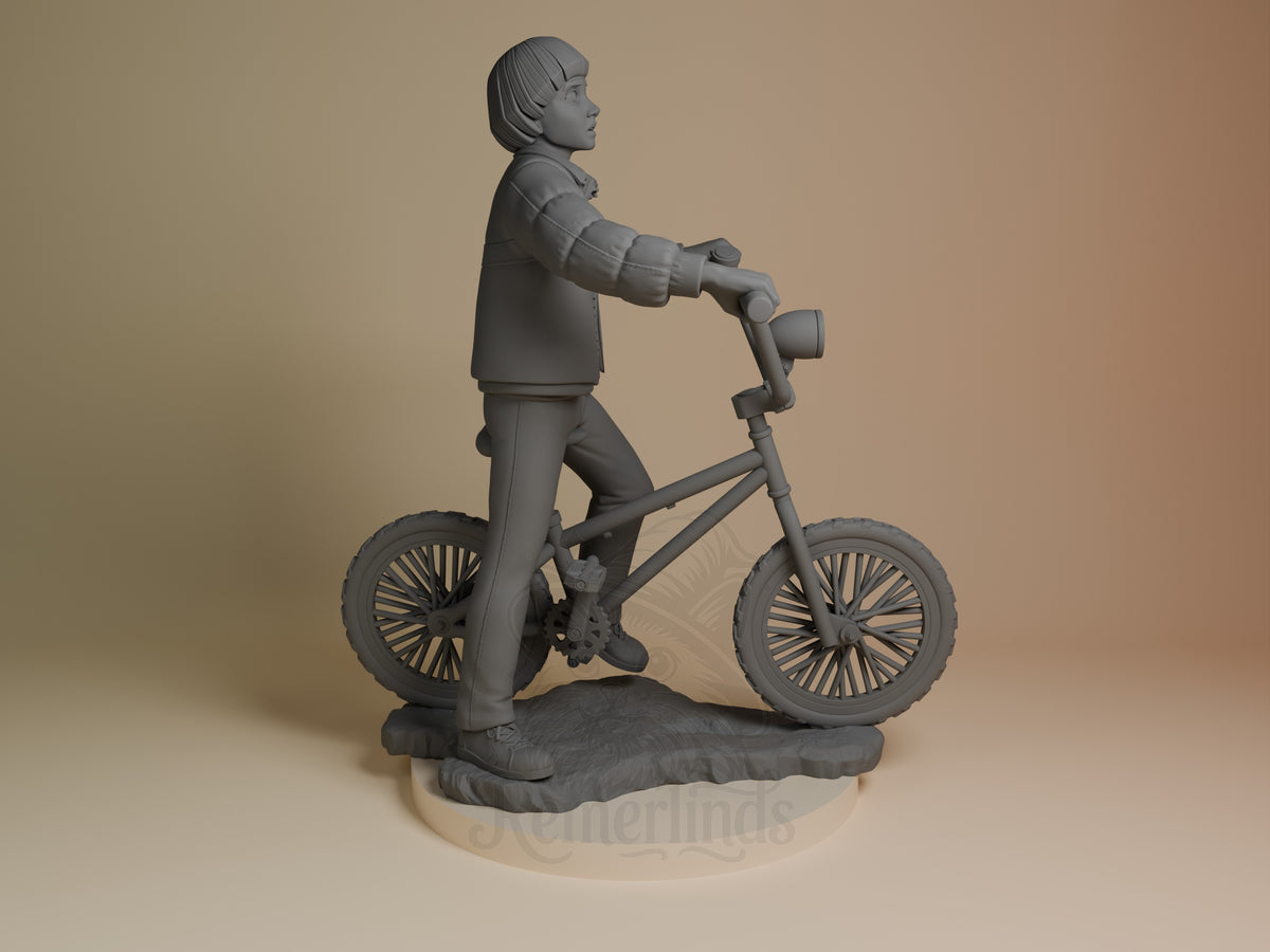 Will from Stranger Things resin figure on base, shown from the right side standing with bicycle, wearing jacket and pants, unpainted gray.