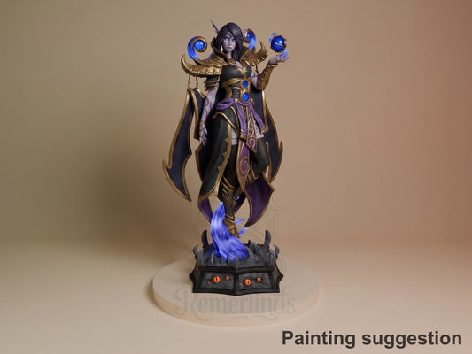 Xal'atath resin figure from World of Warcraft, painted in gold, purple, and blue, posed floating with magical orbs, dark base with blue effects.