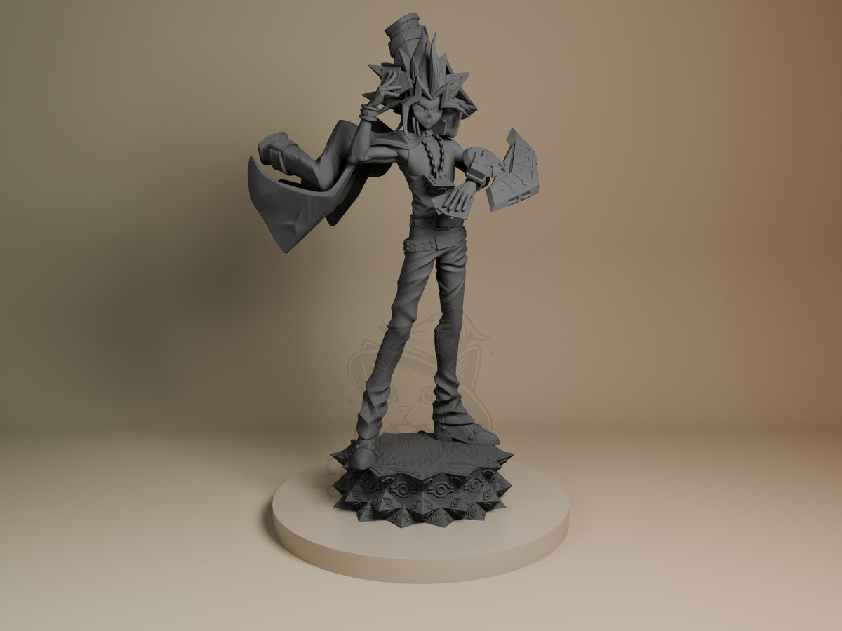Front view of Yugi from Yu-Gi-Oh! as an unpainted resin figure holding cards on a sculpted base.