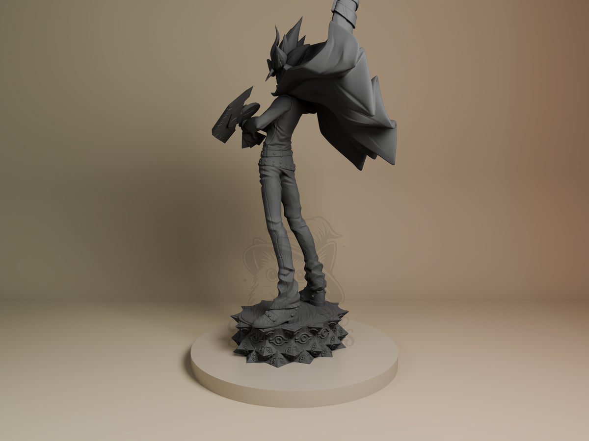 Yugi from Yu-Gi-Oh! stands in profile holding cards on a sculpted base as an unpainted resin figure.