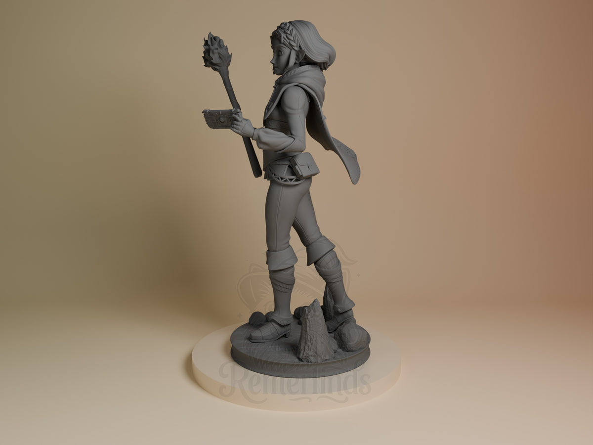 Princess Zalde resin figure from Tales of Daelz, unpainted gray, shown at angle holding staff and orb, wearing cape and armor on rocky base.