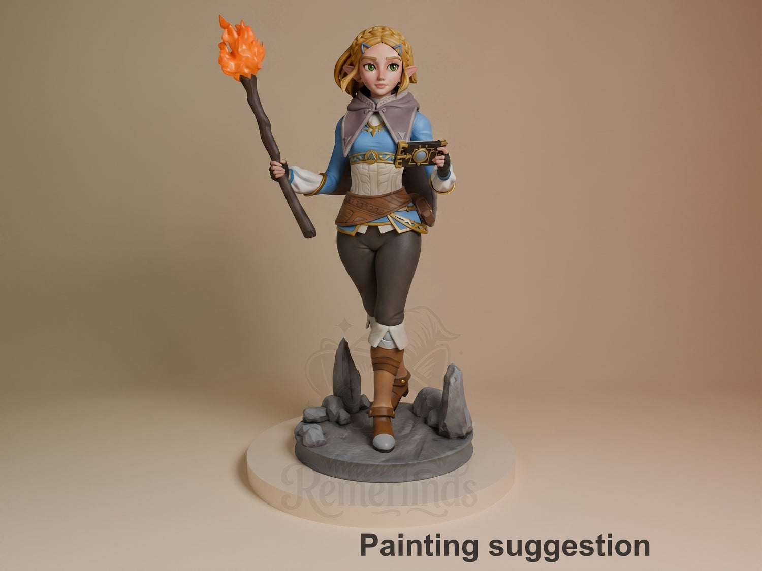 Princess Zalde resin figure from Tales of Daelz, painted in blue and gold robes, holding a flaming staff and gun, standing on rocky base.