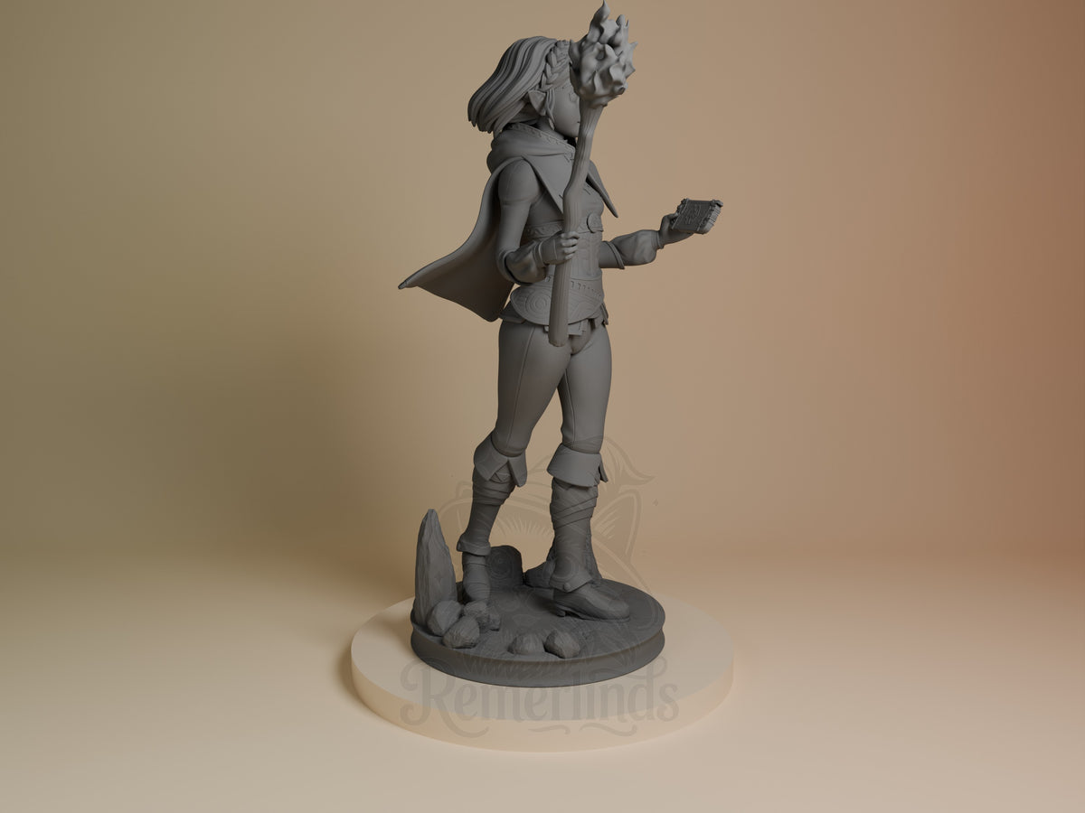 Princess Zalde resin figure shown from right side, unpainted gray, standing with staff raised and tablet in hand on rocky base.