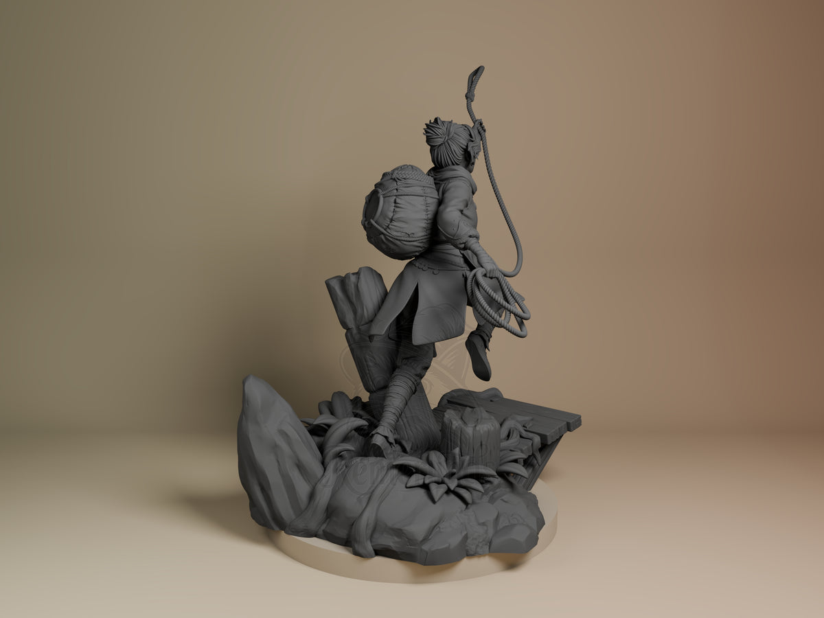 Zoe from Split Fiction resin figure shown from behind, unpainted gray, mid-leap with staff raised, detailed base with flora, backpack visible.